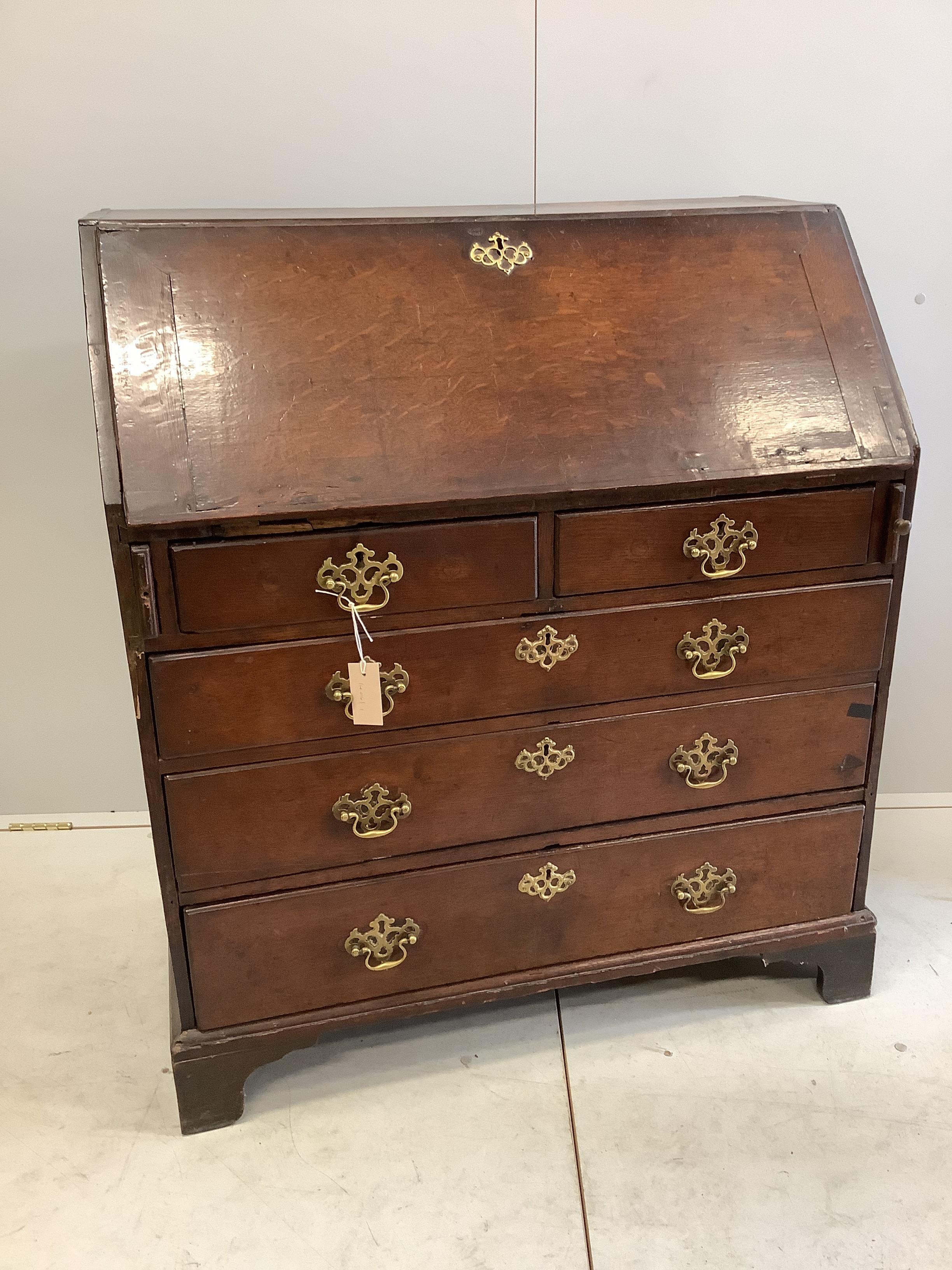 A George III oak bureau, width 91cm, depth 51cm, height 105cm